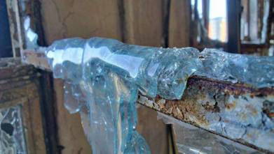 6. Melted Glass in a Fire                                         Damaged Building...
