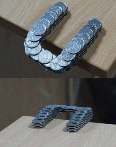 46. Coins Stacked in Such a                                       Way That They Extend Past the Edge                                       of the Table...