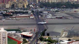 31. The Runway at the                                         Gibraltar International Airport                                         Has a Road Crossing It...