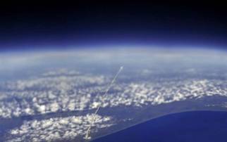 33. View of Space Shuttle                                         Atlantis from the International                                         Space Station...