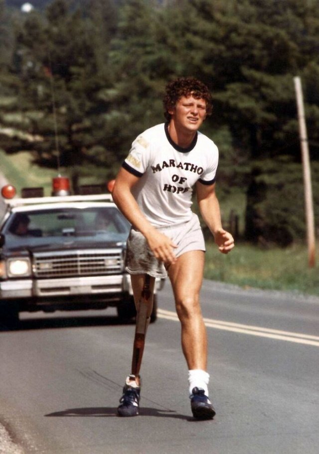 Poignant Photos A photo of Terry Fox, a 21-year-old Canadian who lost a leg to cancer during his east to west cross-Canada run. Fox raised money for cancer research and spread awareness about cancer.