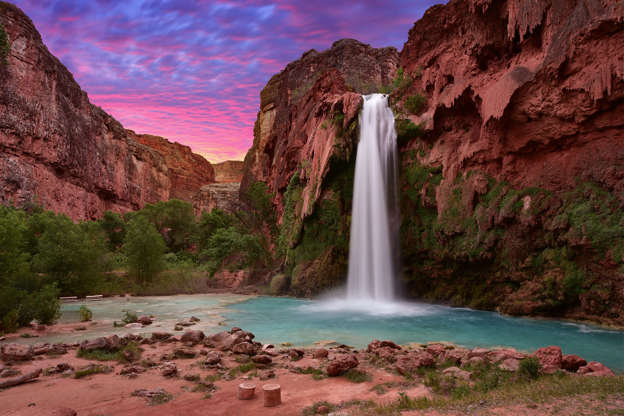 Slide 2 of 31: One of the most stunning waterfalls in the United States is also one of the hardest to visit. Havasu Falls are on the Havasupai Reservation near the Grand Canyon, and the tribe strictly controls access. Permits, which require an overnight visit, sell out quickly, and if you do snag one, you better be in good shape: It's a 20-mile round-trip hike, with tough terrain and the hot Arizona sun to contend with. Related: Beyond Niagara: Where to Find Waterfalls in All 50 States