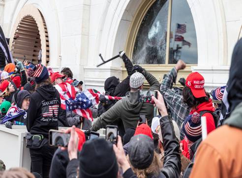 Protesters break windows of the U.S. Capitol building on January 6, 2021.
