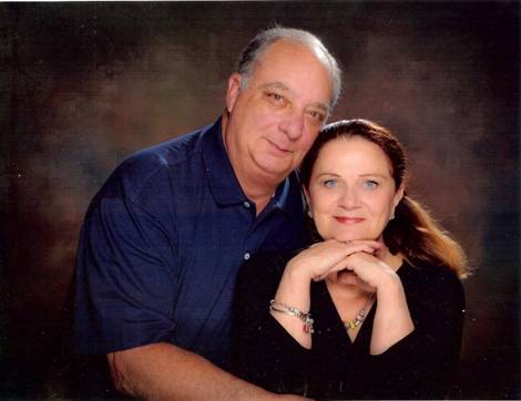 Two people posing for a photoDescription automatically generated with medium confidence